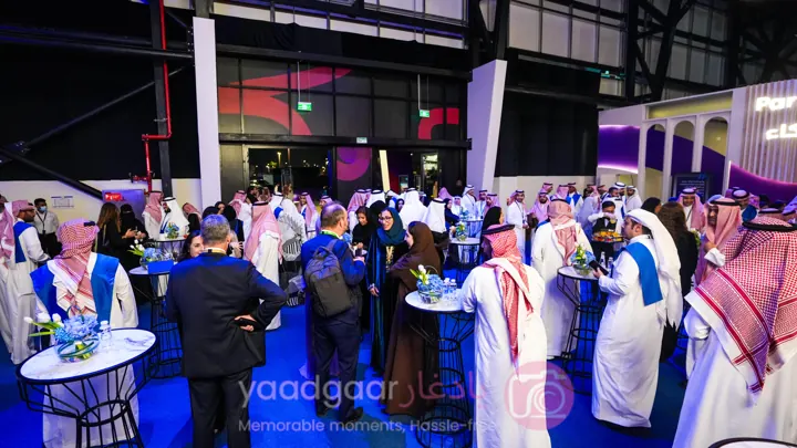 Guests at an illuminated exhibition stand