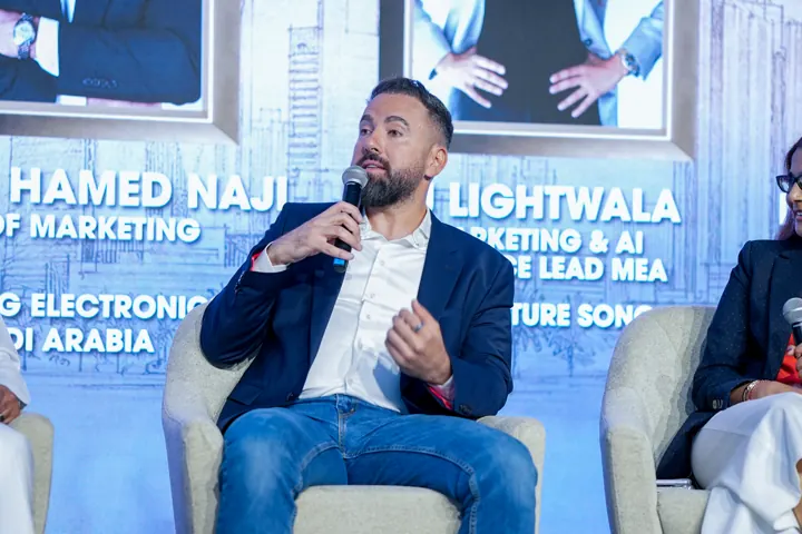 Conference speaker addressing a panel