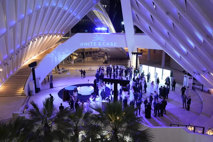 Evening event beneath an architectural canopy