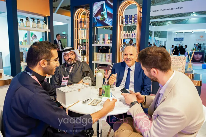 Exhibitors discussing products with visitors
